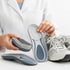 A Doctor choosing the perfect insoles for patients.