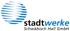 Blue globe icon with black and blue text "stadtwerke Schwäbisch Hall GmbH" on a dark green background.