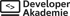 Logo der Developer Akademie mit einem Laptop-Symbol und Coding-Klammern auf schwarzem Hintergrund.