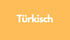 Das Wort "Türkisch" in weißer Schrift auf orangefarbenem Hintergrund.