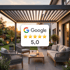 Google-Bewertung von 5,0 Sternen über eine moderne Pergola mit Außenmöbeln bei Sonnenuntergang.
