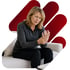 A pained woman seeks nerve pain treatment while clutching her wrist.