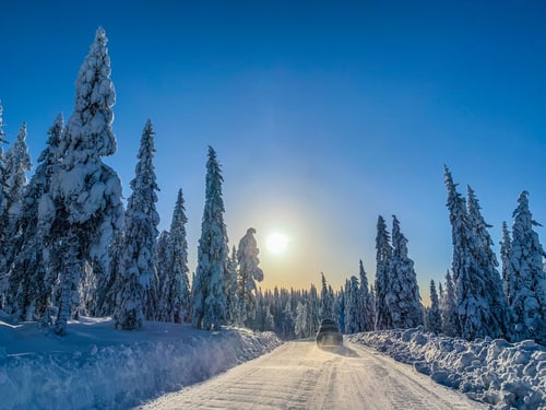 Car on a snow-covered road in winter near Cranston, Rhode Island
