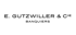 Schwarzer Text "E. GUTZWILLER & CIE BANQUIERS" auf grünem Hintergrund.