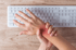 Office worker experiencing carpal tunnel wrist pain