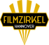 Schwarzer Schriftzug „FILMZIRKEL HANNOVER“ auf goldener, sechseckiger Fläche mit Lichtstrahlen.
