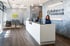 Two women at reception welcoming patients to Balance Wellspace clinic.