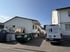 Container und Baustelleneinrichtung an der Seite des Hauses