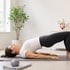 Pelvic health and TMJ care patient performs glute bridge exercise