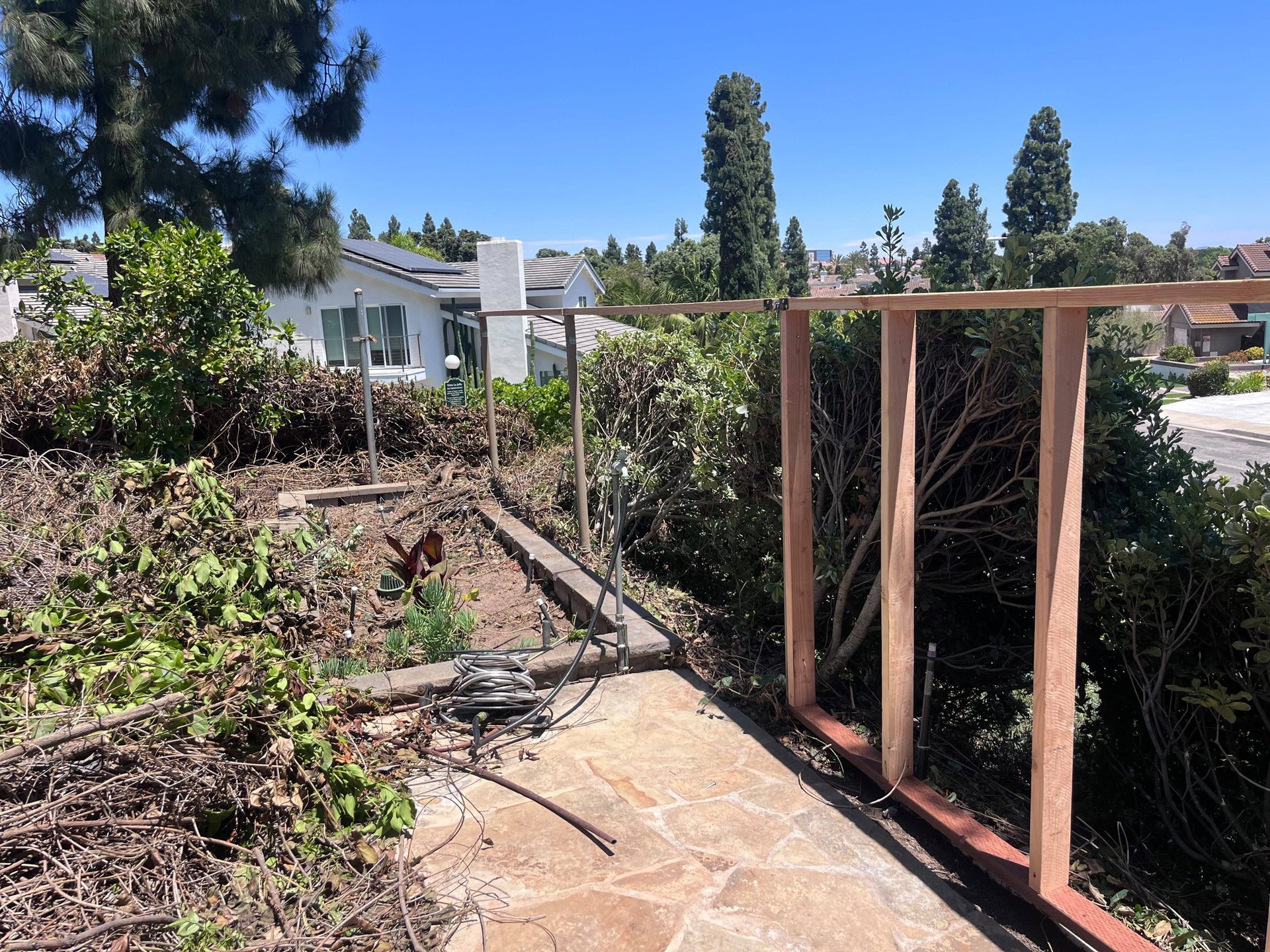 Wood framing for a perimeter fence before James Hardie Architectural Panel installation in San Diego