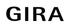 Schwarze Großbuchstaben formen das Wort "GIRA" auf einem dunkelgrünen Hintergrund.