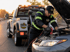 Towing Eastvale jump start service technician restoring power to a dead car battery with professional roadside assistance equipment