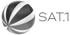 Sat.1 Senderlogo mit einem schwarz-weiß gestreiften Ball auf schwarzem Hintergrund.