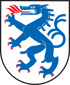 Wappen mit einem blauen Drachen mit roter Zunge und Krallen auf weißem Schild.