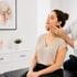 Doctor adjusting a woman's jaw in a clinic