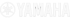 Yamaha Logo mit drei Stimmgabeln in einem Kreis und dem Schriftzug YAMAHA daneben.