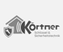 Körtner Schlüssel & Sicherheitstechnik Logo mit Haus, Funksymbol und Schild mit Schlüssel.
