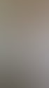 Gespachtelte Trockenbauwand mit runder Eckausbildung aus eingeschnittenen Gipsplatten an einer Treppe im Rohbau.