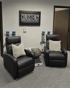 Recliners with pillows facing a motivational sign at Midwest Pain Relief Center, LLC.