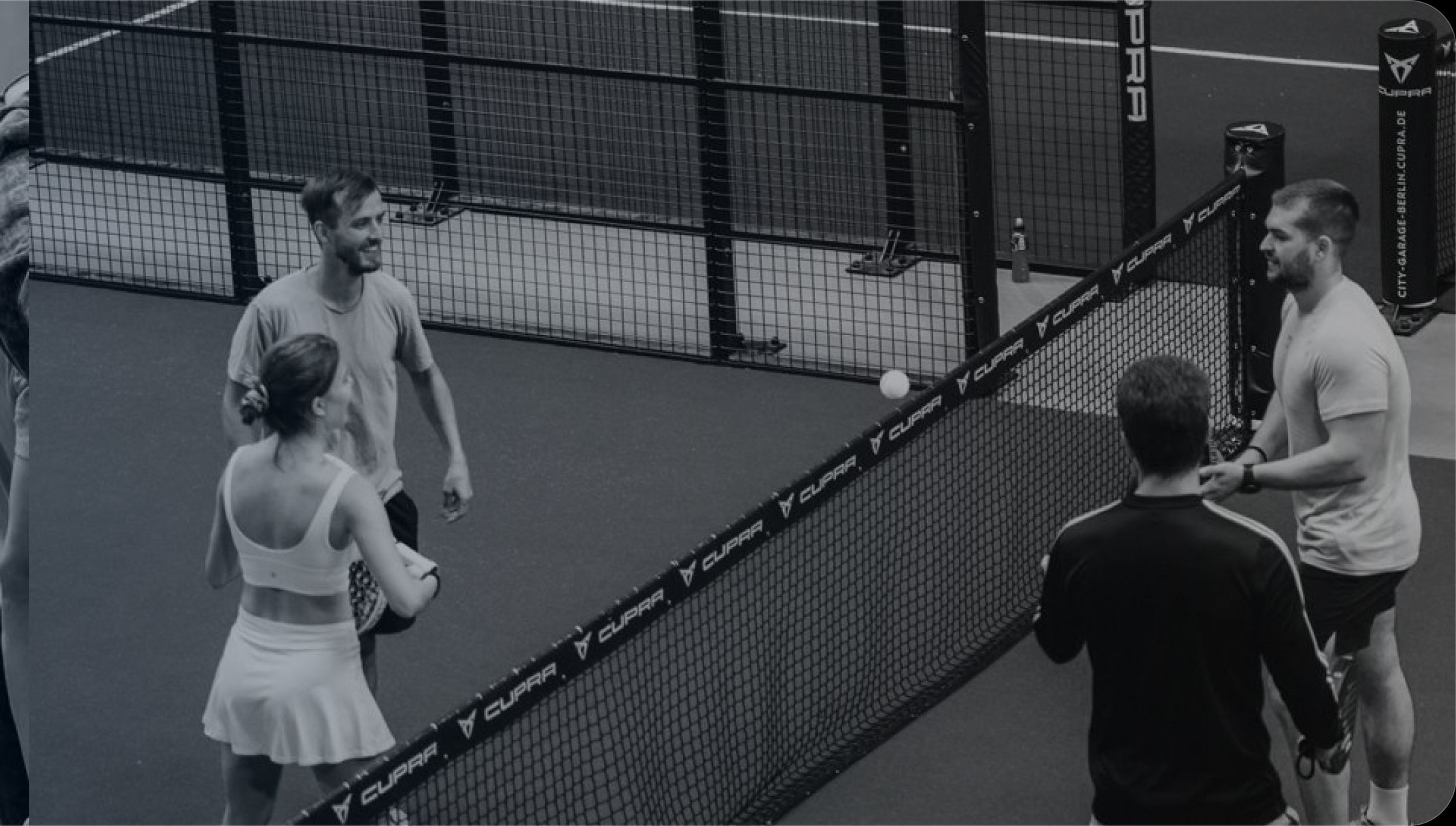 Players on an indoor padel court