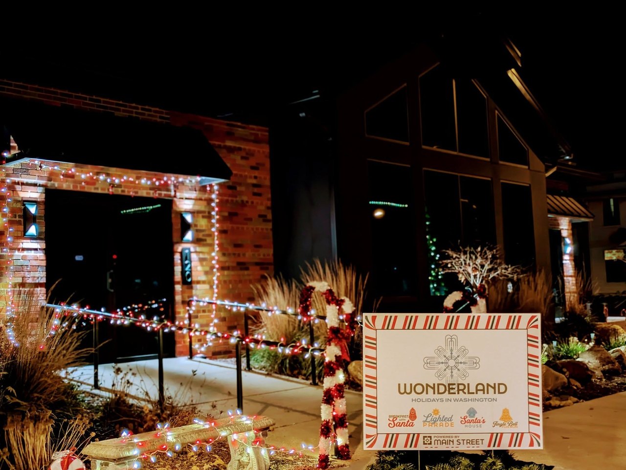 Wonderland sign with holiday lights at night
