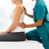 Therapist adjusting patient for sciatica pain relief