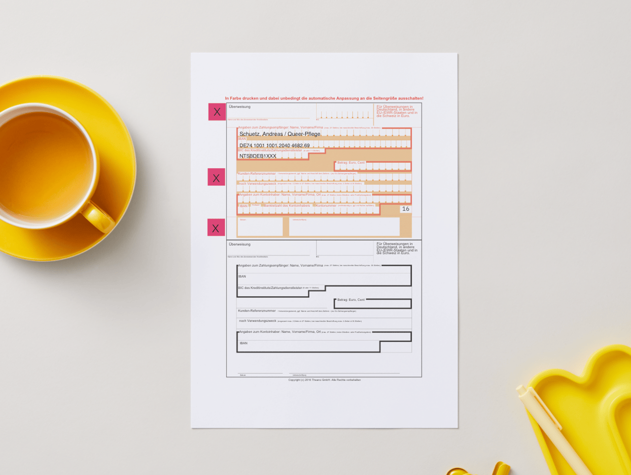 A single white form with red fields and black text lies next to a yellow cup.