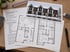 Handskizze des Architekten mit Berechnungen und Referenzbild