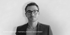 Florian Hämmerle, Partner & Product Development, trägt eine Brille und einen Anzug.