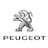 Silbernes Peugeot-Löwenlogo über dem Schriftzug "PEUGEOT" auf grünem Hintergrund.