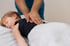 A child is receiving pediatric chiropractic care on their back.