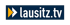 Logo von lausitz.tv mit weißem Schriftzug und gelb-weißem Pfeilsymbol auf dunkelblauem Grund.