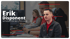 Erik, Disponent, Mitarbeiter im Interview, sitzt mit einer Kollegin am Schreibtisch vor Computern.