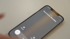 An iPhone displaying an incoming call from "Real Estate Blondies" on a white surface.