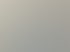 Vier Personen lächeln vor einem Flipchart und einem Verkaufsdisplay mit Kosmetikprodukten.