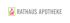 Logo: Rotes Haus-Symbol mit grünem Rahmen, daneben grauer Text „RATHAUS APOTHEKE“.