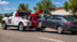 Towing Corona wheel lift towing service transporting a disabled sedan safely to its destination.