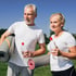 Senior couple outdoors with yoga mats and water staying active