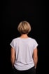 Person seen from behind, representing the private work behind every public performance
