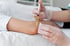 Gloved hands performing PRP injection on patient’s arm