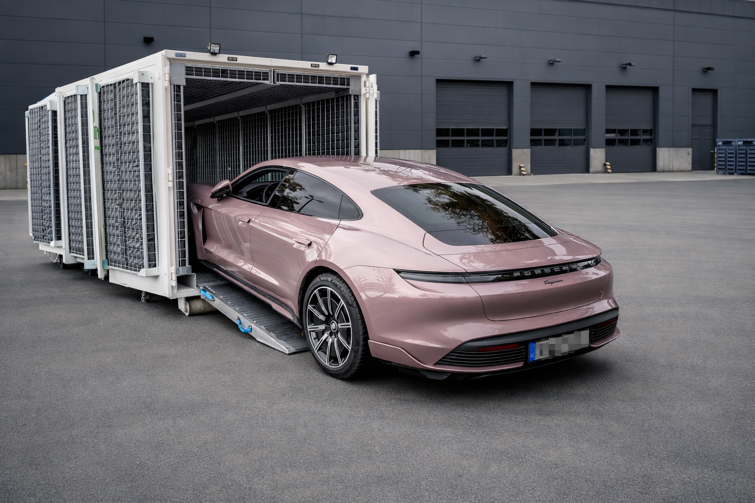 Vehicle driving into the container over the loading ramp