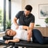 Pain control chiropractor performs side-lying patient adjustment