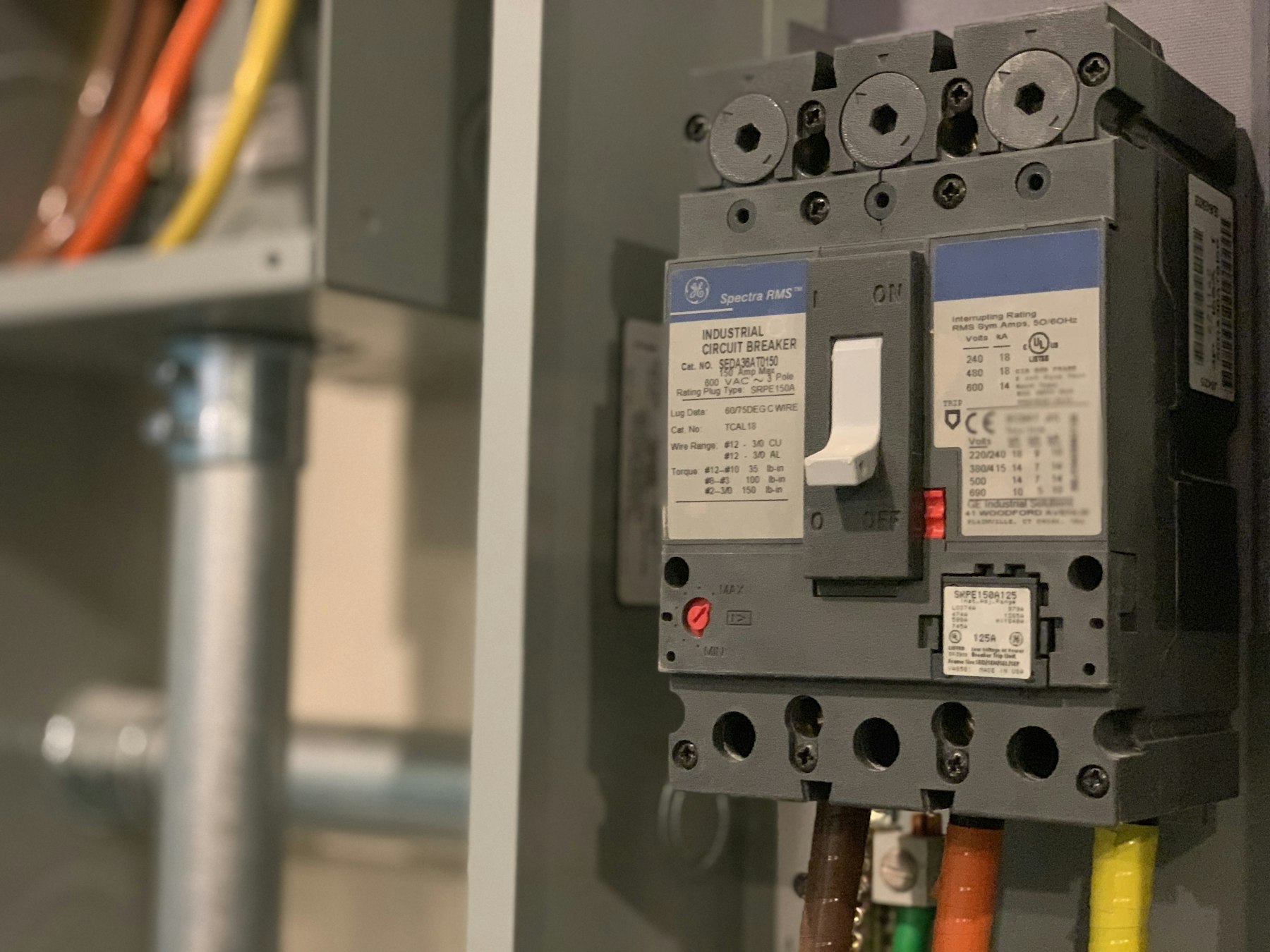 Electrical service panel being inspected during an EV charger repair visit