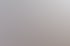 Ein Mitarbeiter prüft mit einem digitalen Messgerät eine Steckdose in einer Wand.