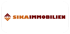 Logo von Sika Immobilien mit orangefarbenem und braunem Text und einem stilisierten Pfeilsymbol.