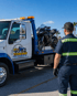 Towing Port Charlotte motorcycle towing service transporting a sport bike on a flatbed tow truck.