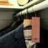 Cedar plank placed beside folded wool sweaters