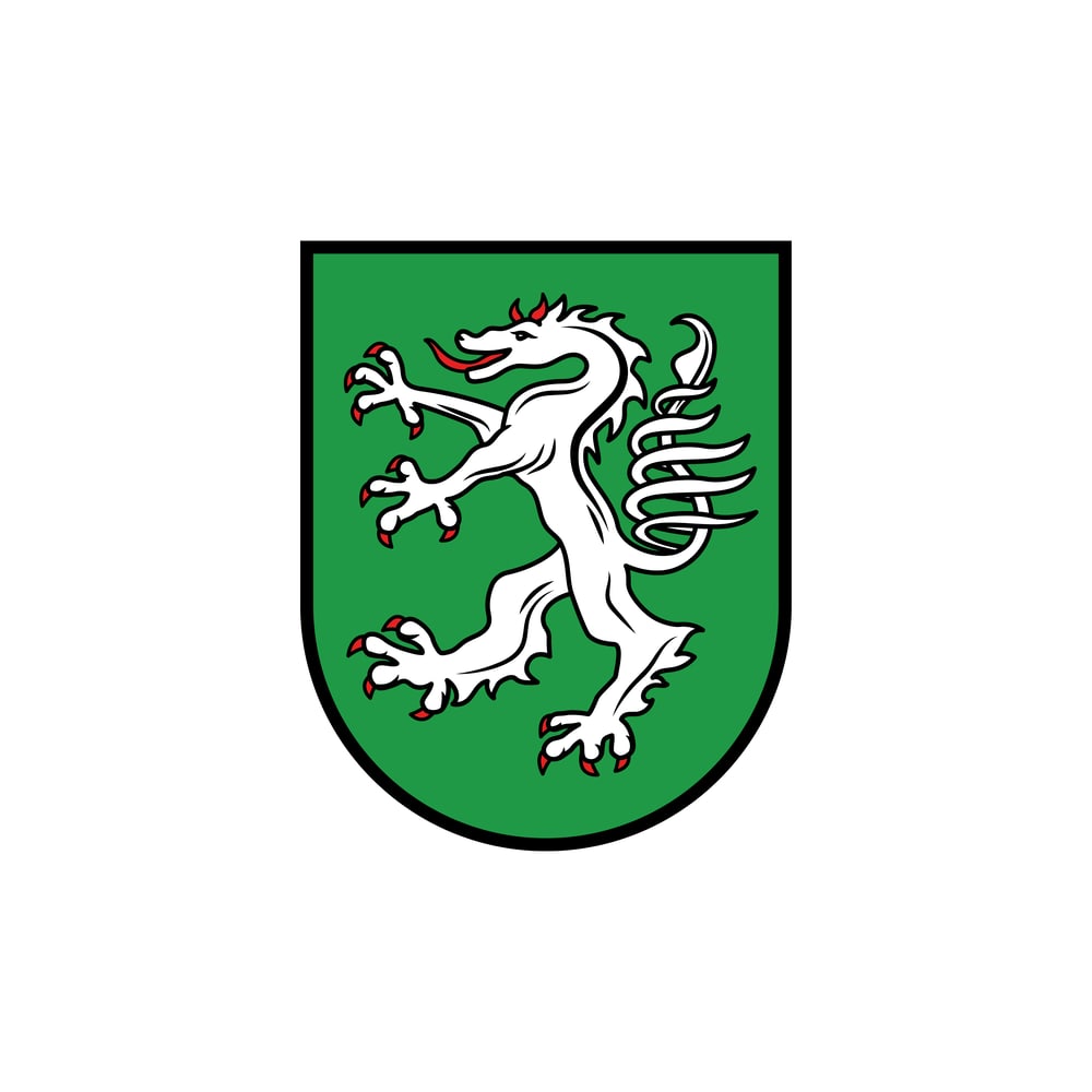 Grünes Wappen mit aufrechtem, weißem Löwen mit roter Zunge und Krallen, schwarzer Rand.