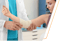 Doctor treats an auto accident injury in MacArthur, WV, bandaging an elbow.