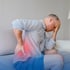 Man holding his painful lower back